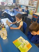 Kids reading at desk